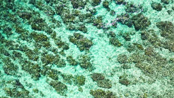 Luxury overhead clean view of a white sandy paradise beach and turquoise sea background