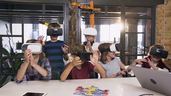 Happy Young Pupils of Elementary School Using Virtual Reality