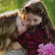 Young Woman and Child Hugging in Field - VideoHive Item for Sale
