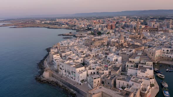 Flight over Monopoli at sunset, Apulia, Italy