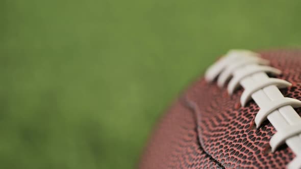 American Football Close up on on green grass.