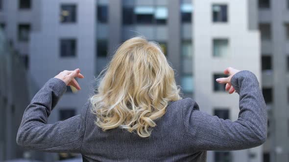 Business Lady Raising Arms, Confident in Goal Achievement, Success Motivation