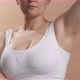 Caucasian Anonymous Young Woman in White Top Spraying Deodorant on Her Underarm - VideoHive Item for Sale