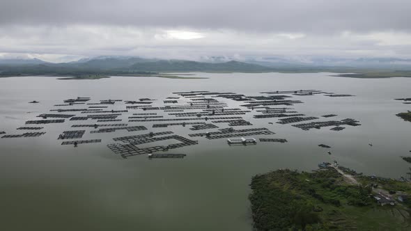 Aerial view of traditional floating fish pond on lake in Indonesia