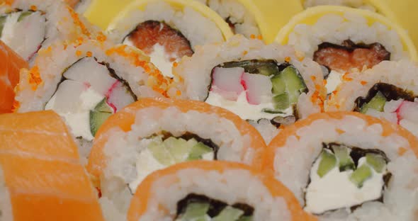 Seafood Sushi Is Laid Out In A White Dish. Rotation