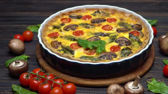 Traditional French Baked Homemade Quiche Pie on Wooden Cutting Board