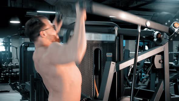 A Man Bodybuilder Doing Strength Exercises