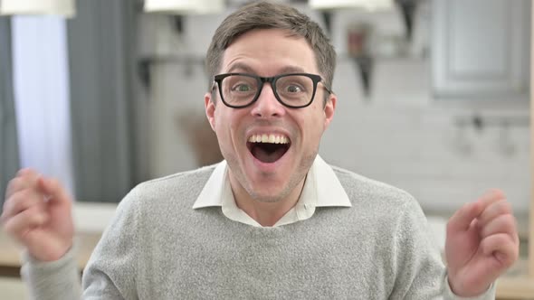 Excited Young Man Celebrating Success, Win