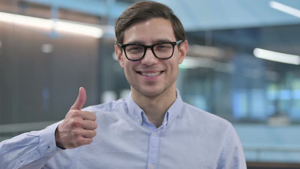 Portrait of Young Man Showing Thumbs Up Sign