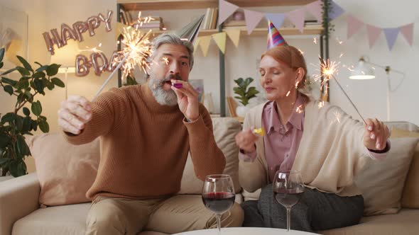 Middle-Aged Couple Celebrating Birthday At Home