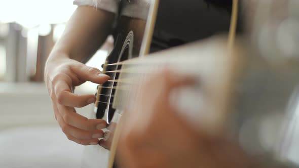 Woman Playing Guitar