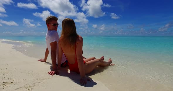 Beautiful lady and man on romantic honeymoon spend quality time on beach on white sand 4K background