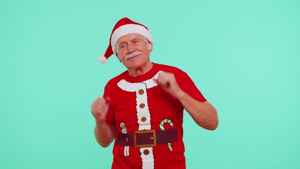 Senior Christmas Grandfather Listening Music Via Earphones Dancing Disco Fooling Around Having Fun