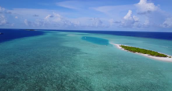 Natural flying island view of a white sand paradise beach and aqua blue ocean background in high res