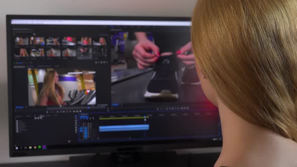 A Blonde Woman Sits at a Computer and Edits a Video - Closeup