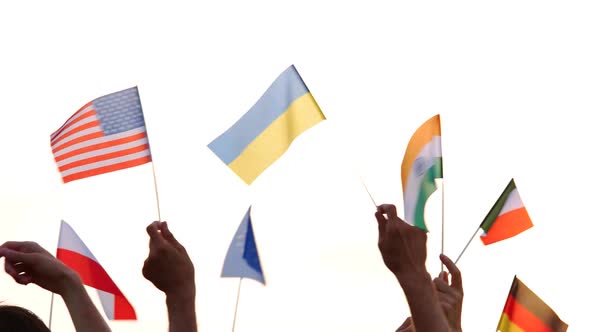 Human Hands Waving International Flags