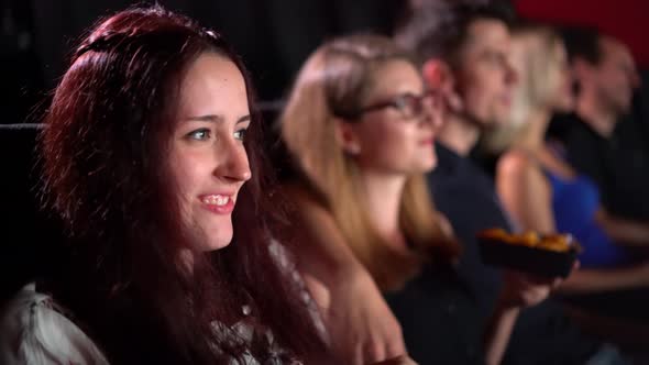 Young People in a Movie Theater Watching a Film