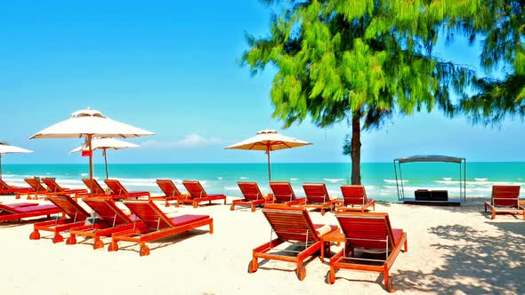 Umbrella and chair on the beach and sea landscape for travel