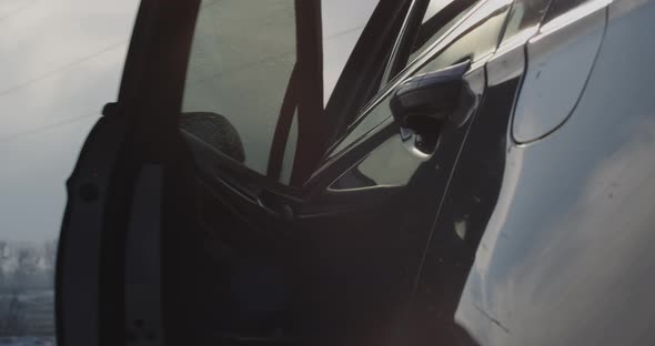 Car Door Handle Close Up. Business Man Opens The Door And Gets Behind The Wheel