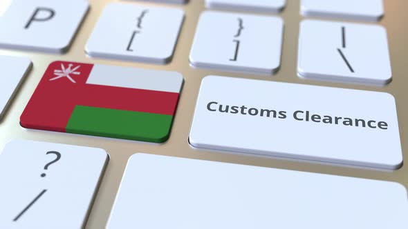 CUSTOMS CLEARANCE Text and Flag of Oman on the Keyboard