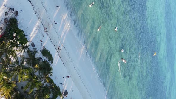 Vertical Video Boats in the Ocean Near the Coast of Zanzibar Tanzania Aerial View