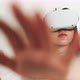 Close up of hands while young female wears goggles to experience VR - VideoHive Item for Sale