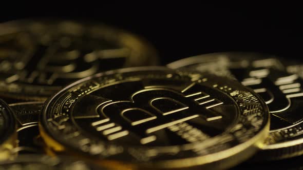 Rotating shot of Bitcoins (digital cryptocurrency) - BITCOIN 0568