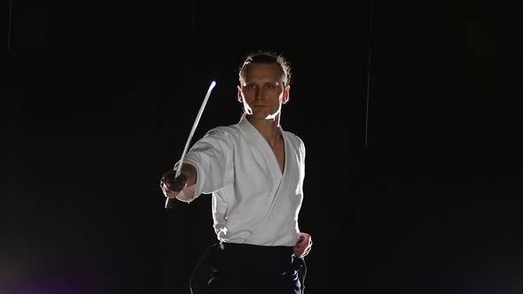 Man Fighting at Aikido Training with Japanese Sword Katana in Martial Arts School. Healthy Lifestyle