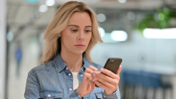 Attractive Young Woman Using Smartphone