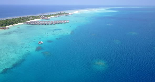 Tropical fly over clean view of a paradise sunny white sand beach and turquoise sea background in hi