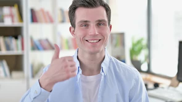 Thumbs Up By Young Man Student