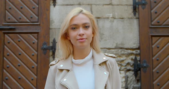 Close-up Portrait of Young Woman, Smiling Looking at Camera. Beautiful People, City Lifestyle.