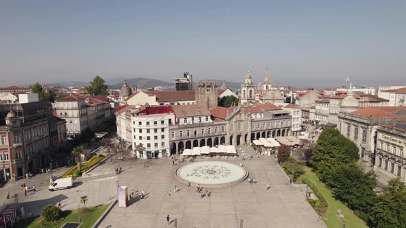 People walking in Braga downtown across the republic square and lapa church