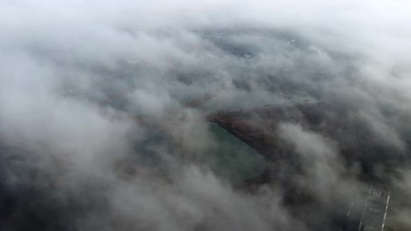 Aerial Drone View Flight Over White Clouds of Mist Artificially Created Lakes