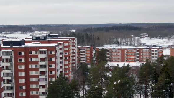 Stockholm Apartment Buildings With Winter Snow Cover - Aerial Flyover