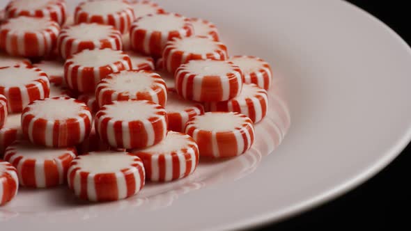 Rotating shot of peppermint candies - CANDY PEPPERMINT 068