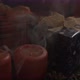 Woman Puts Out Candles on a Table Decorated with Christmas Decorations - VideoHive Item for Sale
