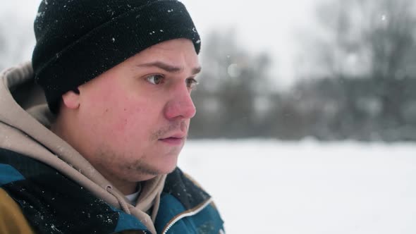 Portrait of a Pilot Who Drives a Quadcopter in Snowfall