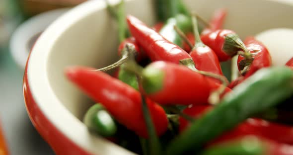 Red chilies and green chilli in bowl 4k