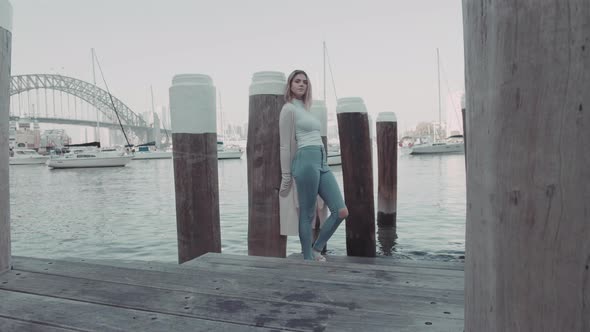 Portrait of a young attractive girl posing with Sydney Harbour Bridge backgroundBeaty and health co