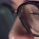 Young Woman in Glasses Uses Computer Tablet Smartphone - VideoHive Item for Sale