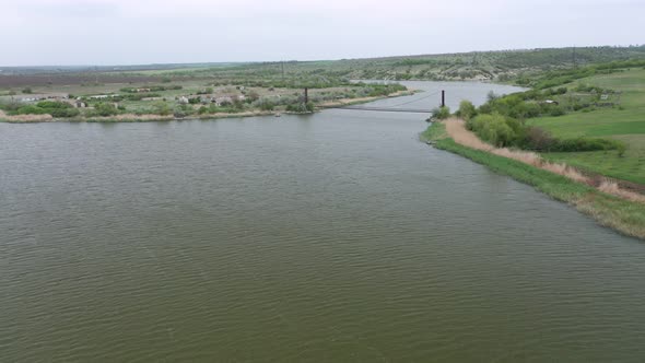 Aerial View of an Old Bridge Over the River