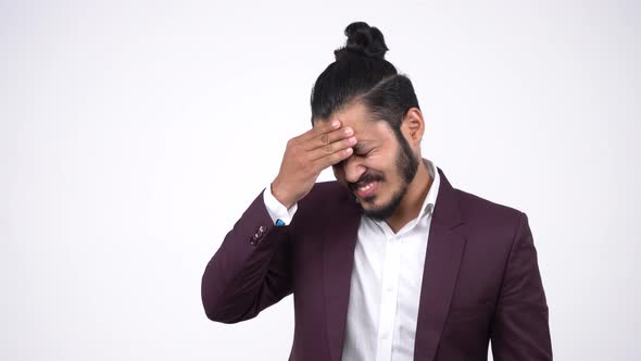 Frustrated and depressed Indian businessman thinking
