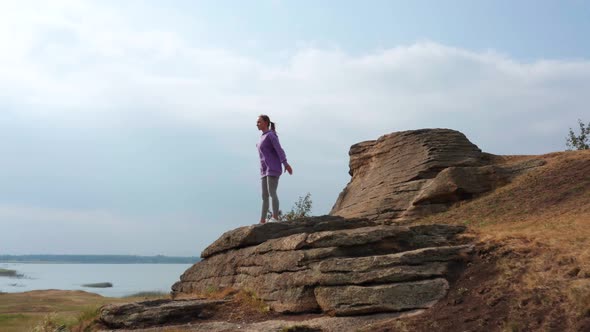 A Girl Does Sports on the Lake Shore