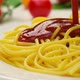 Pouring ketchup on spaghetti, tomato sauce falling on pasta, slow motion - VideoHive Item for Sale