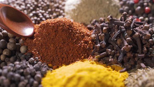 Different Spices and Aromatic Herbs Laid Out on a White Background