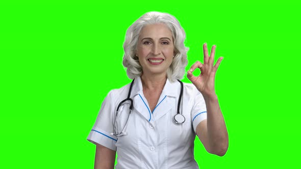Senior Woman Doctor Showing OK Sign