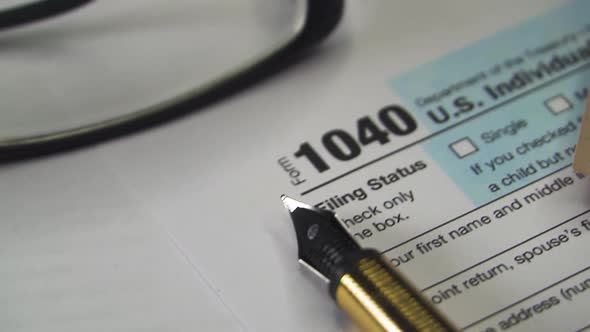 Tax Payment Concept. Filing Taxes Document on Table in Office