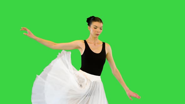 Young Ballerina Performs Ballet Movements on a Green Screen Chroma Key
