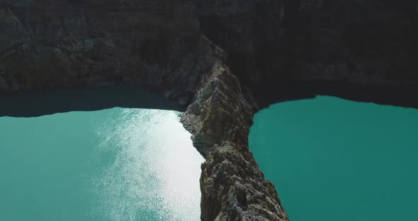 Blue Lake Water in Rocky Natural Volcanic Mount of Kelimutu in Indonesia